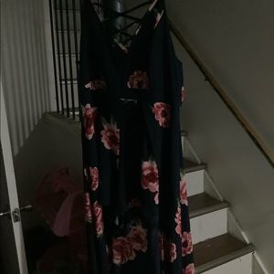 Navy blue romper dress with flowers on it